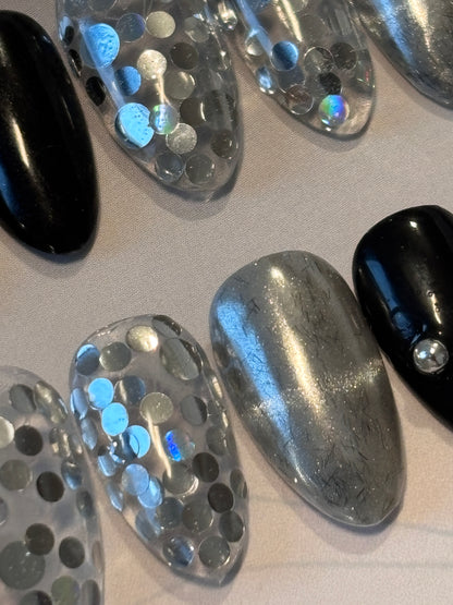 close-up of handmade black chrome and silver glitter press-on nails – Hinra